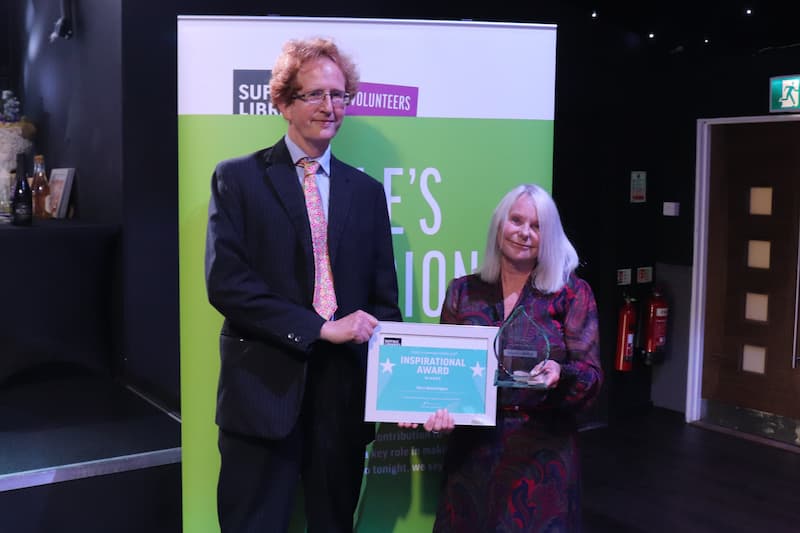 Freddie Gathorne-Hardy, Managing Director of Christie Care, presenting the award to Karen Goffin from Lowestoft Library on behalf of Mary