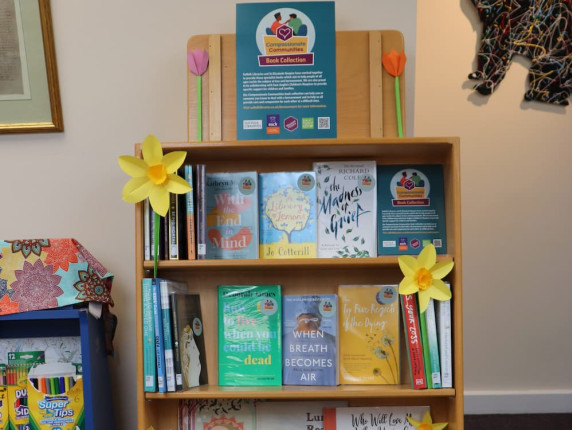 The new book case with the Compassionate Communities book collection at Framlingham Library.