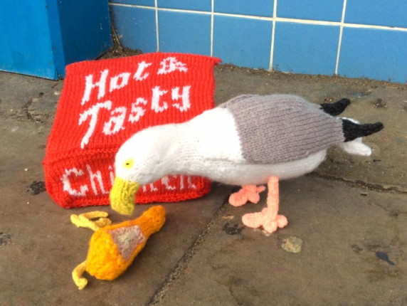 Gull eating fried chicken, a hand-knitted acrylic and wire art piece