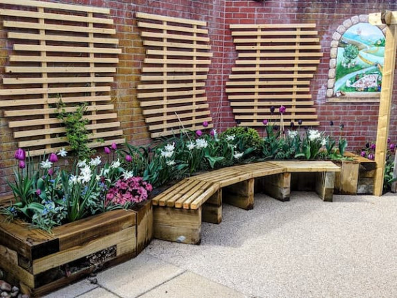 The new seating area and flowers in the Halesworth Library memorial garden.